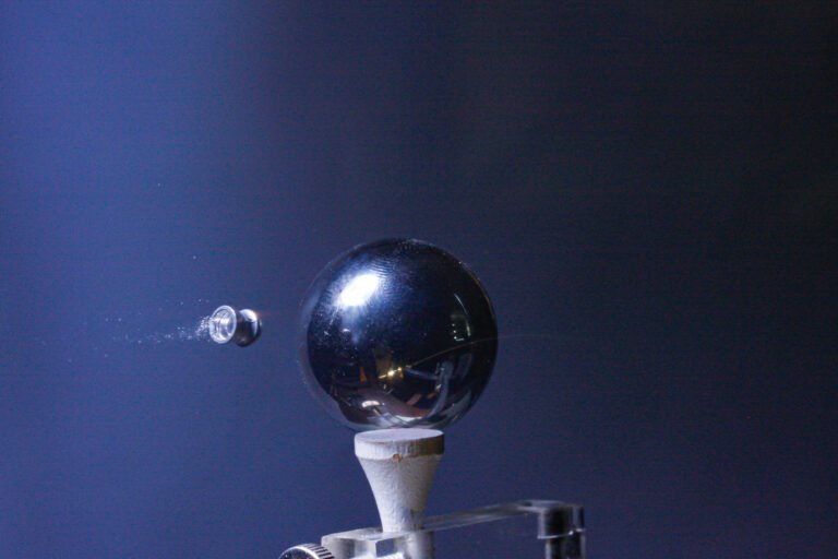 air pistol pellet approaching steel ball on tee at 450 fps