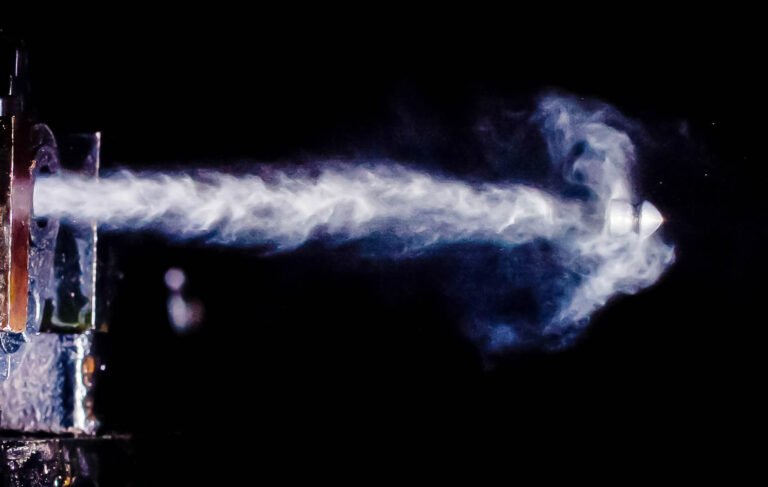 Air pistol pellet leaving the muzzle at about 450 fps.